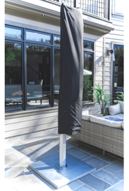 Commercial patio umbrella protected with weather-resistant storage cover for extended outdoor furniture lifespan and seasonal protection